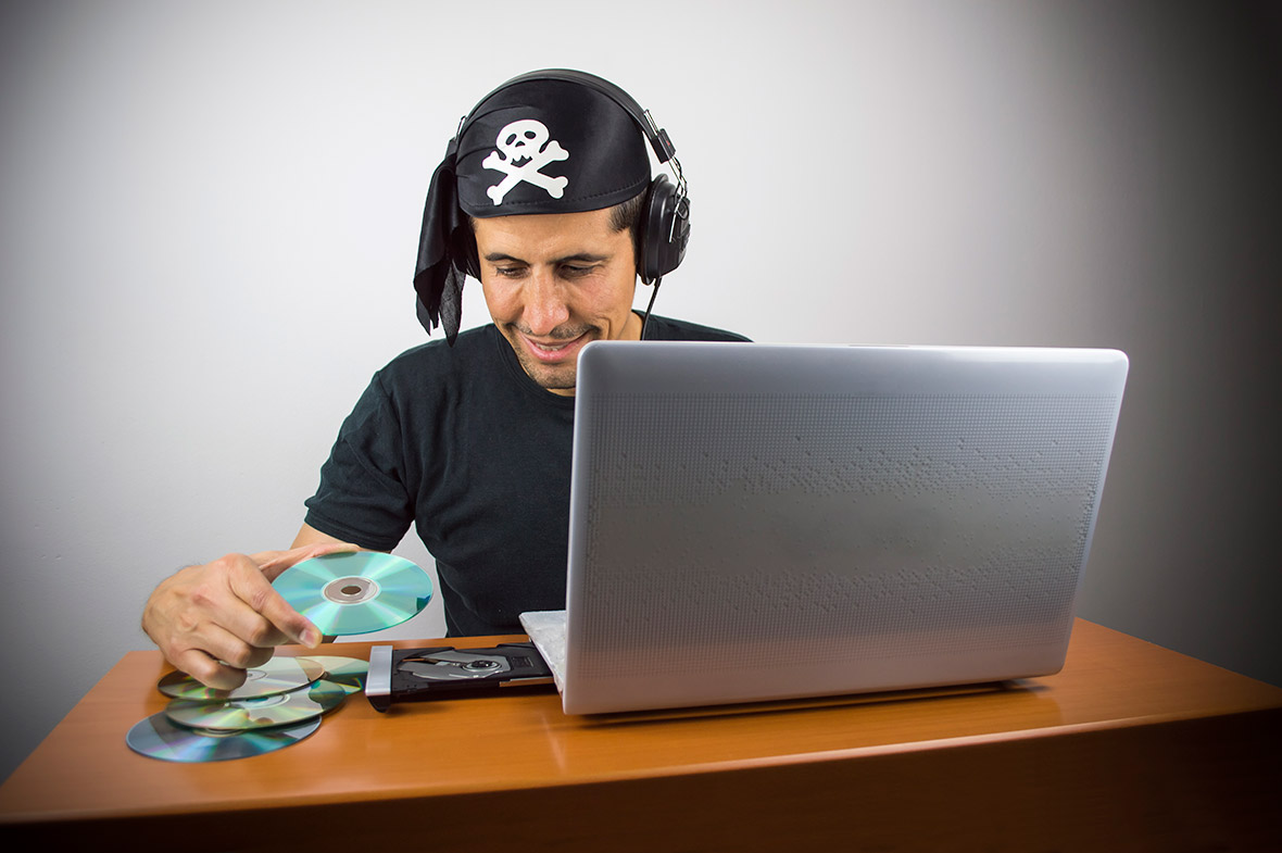 A pirate committing piracy by pirating CDs